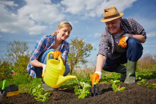 Team handling materials safely during landscaping tasks